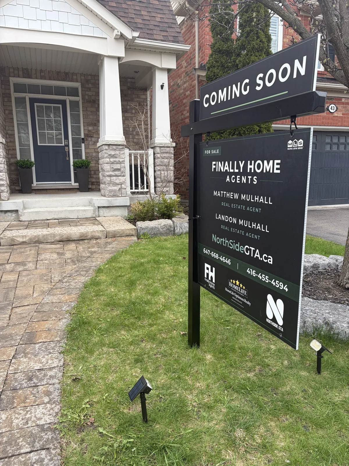 Finally Home Agents coming soon sign in front of a brick two-storey home in Newmarket, Ontario