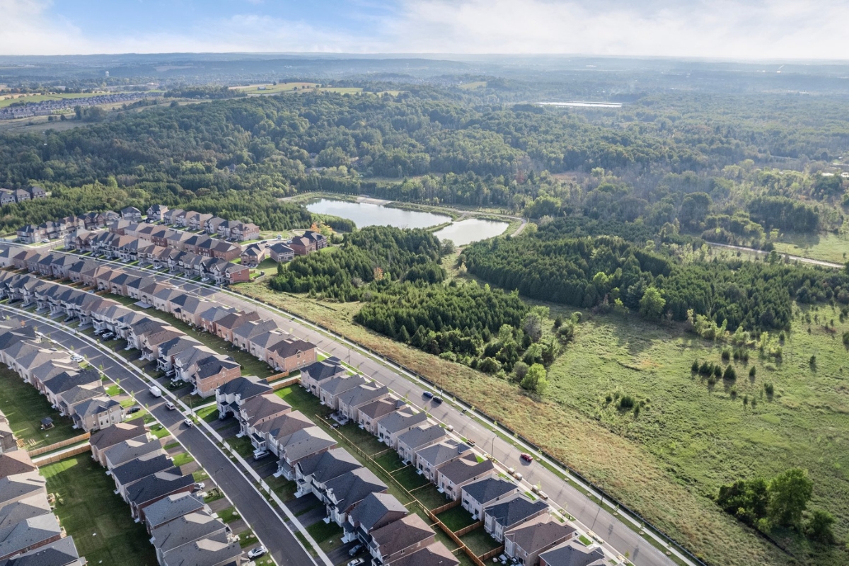 A high-resolution aerial view of Queensville in East Gwillimbury, showing new homes, green space, and master-planned communities near Highway 404.