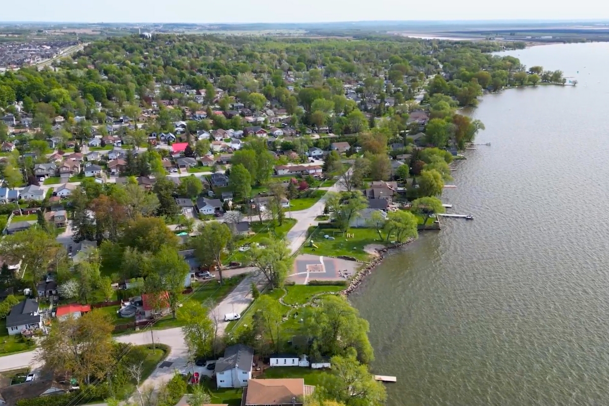 A high-resolution aerial view of Keswick in Georgina, showing waterfront homes, marinas, neighbourhoods, and the shoreline along Lake Simcoe