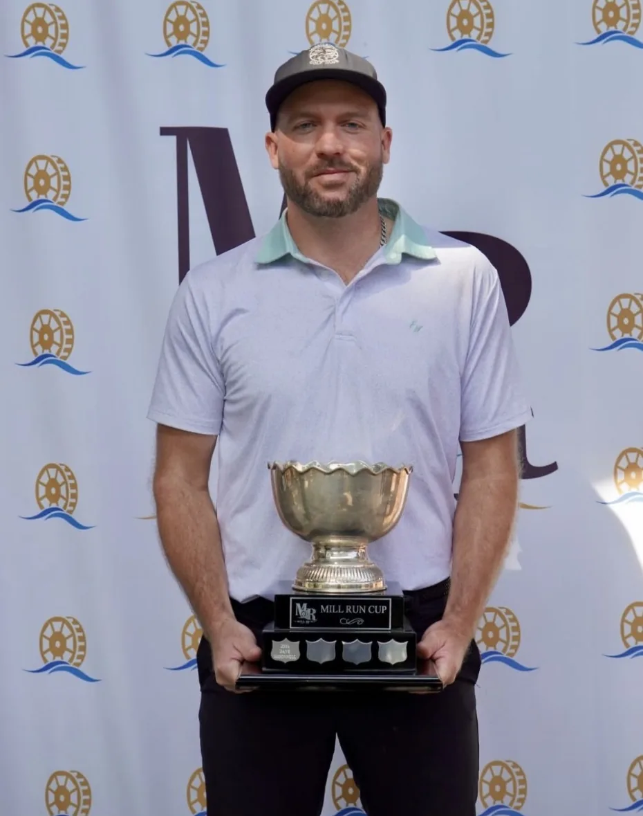 Matthew Mulhall holding the Mill Run Cup trophy in Uxbridge, Ontario